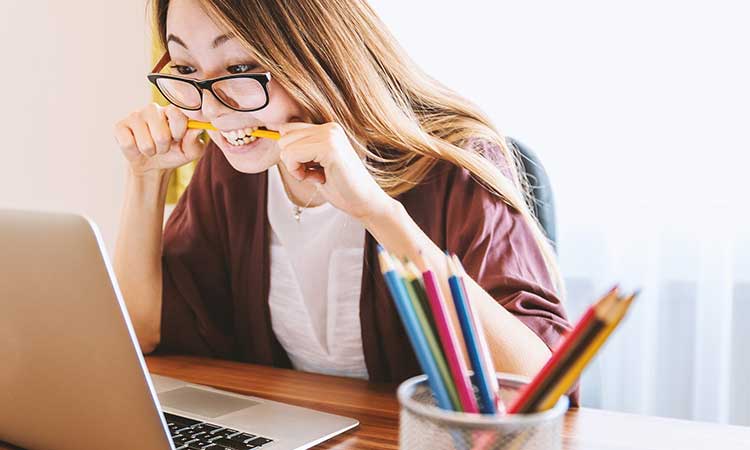 Avoid stress, woman bites on pen